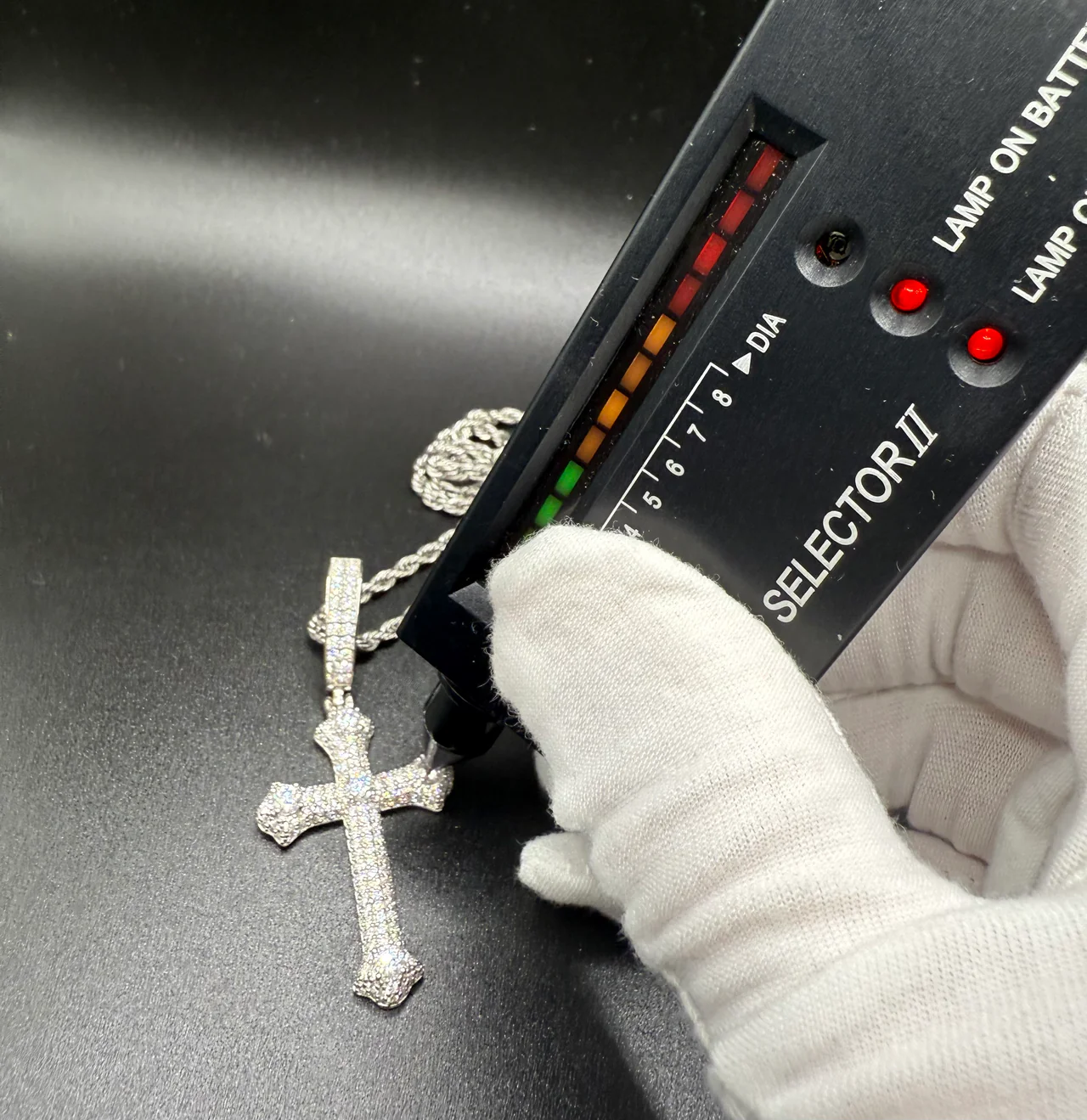 Iced cross pendant passing a Selector II diamond tester